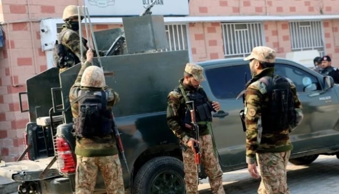 Security personnel stand guard outside a hospital in Dera Ismail Khan, KP. — Reuters/File