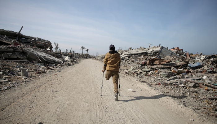 A displaced Palestinian makes his way past rubble, as Palestinians attempt to return to their homes, following a delay in the ceasefire between Israel and Hamas over the hostage list, in Rafah, in the southern Gaza Strip, January 19. — Reuters