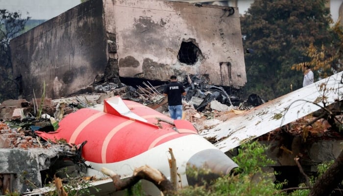A fire officer stands next to the crashed Air India Boeing 787-8 Dreamliner aircraft, in Ahmedabad, India, June 13, 2025. — Reuters