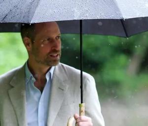 Prince William misses Princess Kate as he braves rain in solo outing
