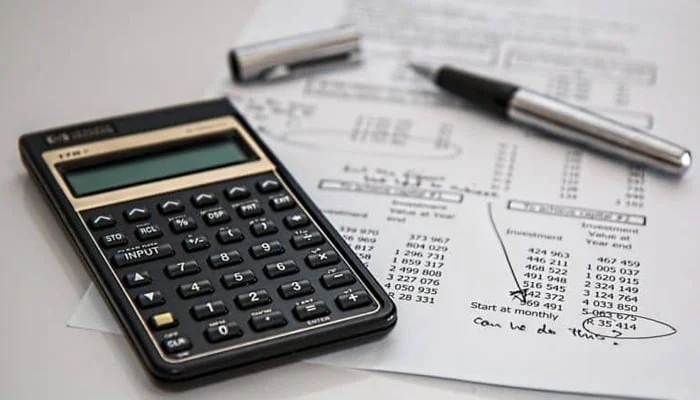 A representational image of calculator and planning sheet. — Reuters