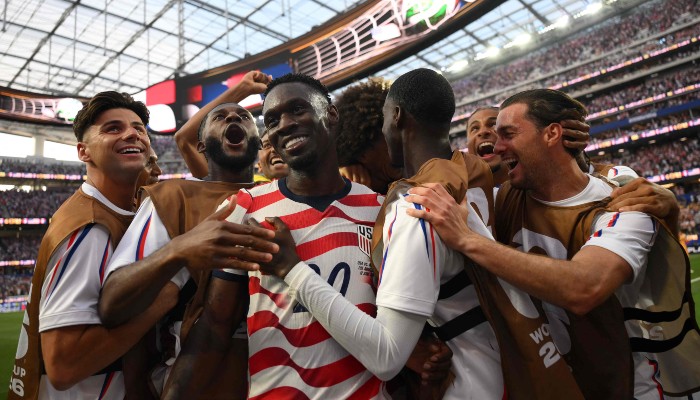 US forward #20 Folarin Balogun (c) celebrates with teammates after scoring his teams third goal during the 2026 World Cup Group D football match between USA and Paraguay at the Los Angeles Stadium in Inglewood on June 12, 2026. — AFP