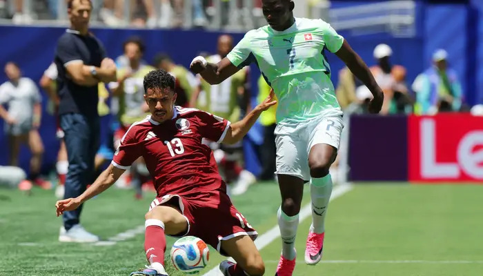 Qatars Ayoub Aloui in action with Switzerlands Breel Embolo at San Francisco Bay Area Stadium, Santa Clara, California, US, June 13, 2026. — Reuters