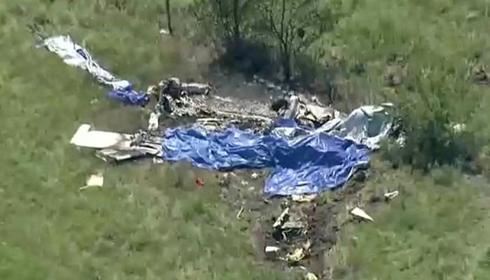 Wreckage lies in a field next to Butler Memorial Airport after a plane carrying skydivers crashed in Butler, Missouri, US, June 14, 2026 in a still image from video. — Reuters