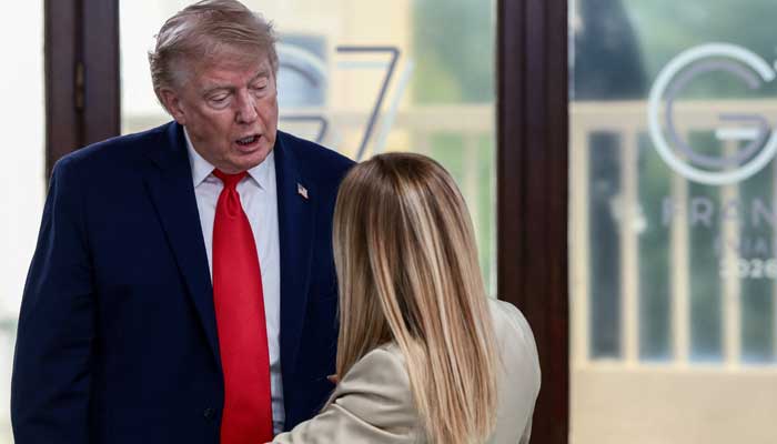 US President Donald Trump speaks with Italian Prime Minister Giorgia Meloni at a working lunch with leaders of G7 and the Middle East, in Evian-les-Bains, France, June 16, 2026. — Reuters