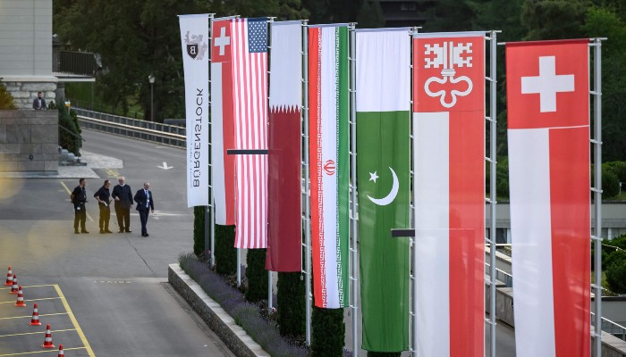 Flags of Switzerland, the United States, Qatar, Pakistan and local Swiss canton of Nidwalden are photographed at the Burgenstock luxury hotel complex overlooking Lake Lucerne, Switzerland, on June 21, 2026. — AFP