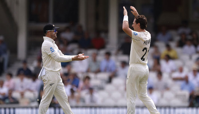 New Zealands Matt Henry celebrates with Tom Latham after taking the wicket of Englands Jordan Cox to win the match in the Second Test against New Zealand in Kia Oval, London, Britain on June 21, 2026. — Reuters