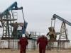 Oil inches down as investors focus on Hormuz flows after peace talks