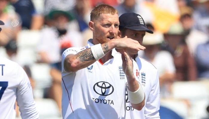 Englands Ben Stokes requests a review after suspecting New Zealands Daryl Mitchell has edged a ball through to the keeper on the second day of their third at Trent Bridge in Nottingham, June 26, 2026. — AFP