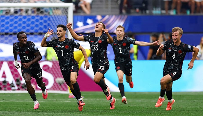 Canadas Stephen Eustaquio celebrates scoring their first goal with teammates. — Reuters/File