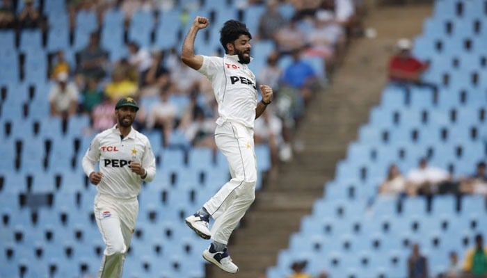Pakistans Aamer Jamal (right) celebrates after the dismissal of South Africas Temba Bavuma (unseen) during the second day of the first cricket Test match between South Africa and Pakistan at SuperSport Park in Centurion on December 27, 2024. — AFP