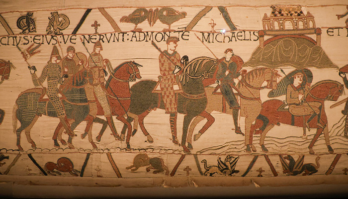 Bayeux Tapestry depicting horsemen and Mont Saint-Michel is displayed at the Bayeux Museum in France, August 29, 2025. — Reuters