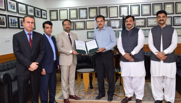NAB Islamabad Director General Waqar Ahmad Chauhan hands over recovered crime proceeds to representatives of the Rawalpindi Development Authority on June 30, 2026. — NAB