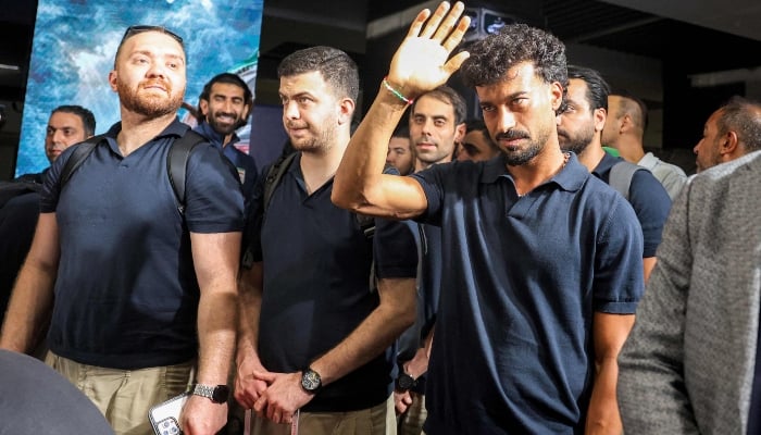 Members of Irans men´s national football team look onduring their reception at Tehrans Mehrabad International Airport on July 1, 2026 upon their return from the 2026 FIFA World Cup. — AFP