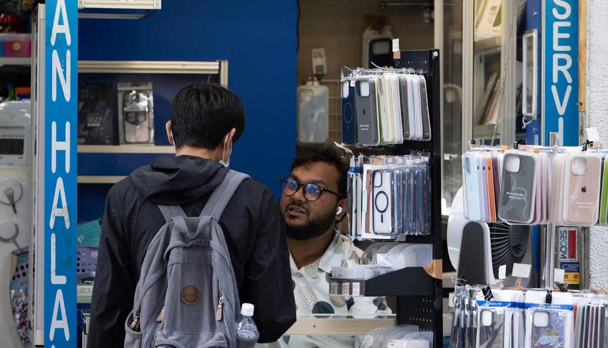 A man goes to a phone repair shop in the Okubo Shin area in Tokyo on June 12, 2026. — AFP