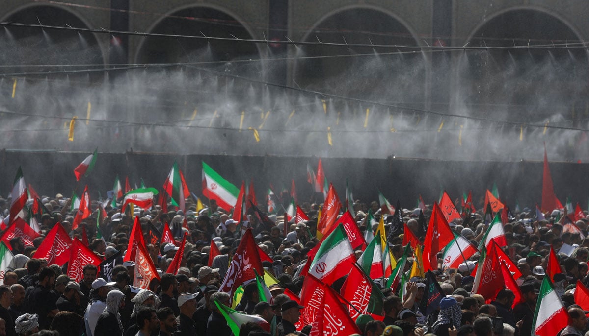 Water is sprayed on people attending a public farewell ceremony to pay their respects to late Supreme Leader Ayatollah Ali Khamenei, who was assassinated on February 28 in Israeli and US airstrikes, at the Imam Khomeini Grand Mosalla, in Tehran, Iran July 4, 2026. — Reuters