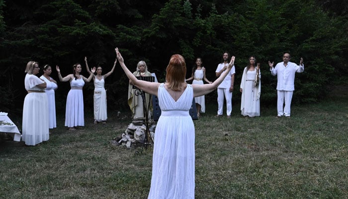 Reenactors dressed as ancient Greeks perform a ritual at the foothills of Mount Olympus as part of the four-day Promitheia Festival honouring ancient Greek Gods, near Litochoro, northern Greece, on July 3, 2026. — AFP