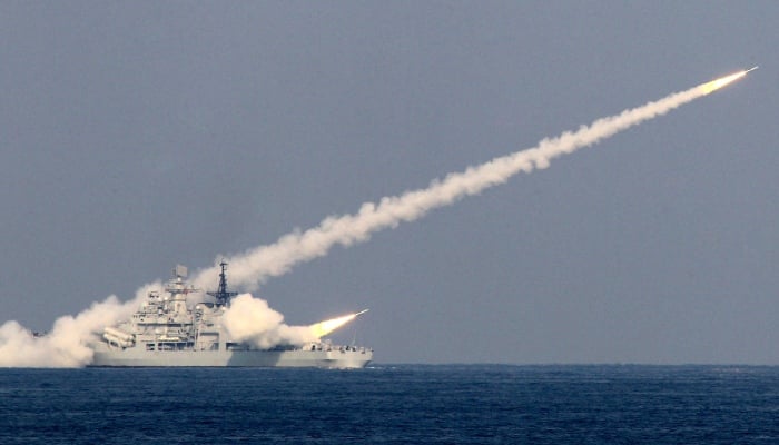 Guided missiles are launched during a drill off the port city of Qingdao, where China’s North Sea Fleet headquarters is located. — Reuters/File