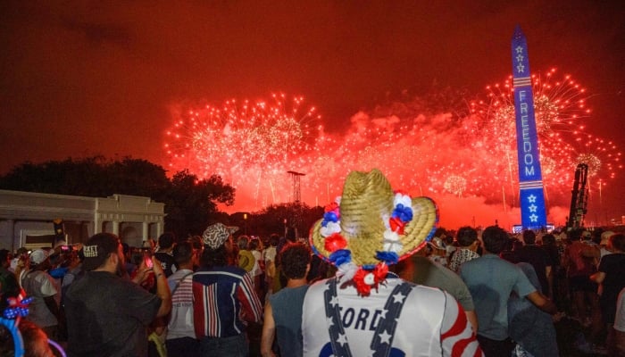 People watch the fireworks from The Great American State Fair along the National Mall after it was reopened in Washington, US on July 4, 2026. — AFP