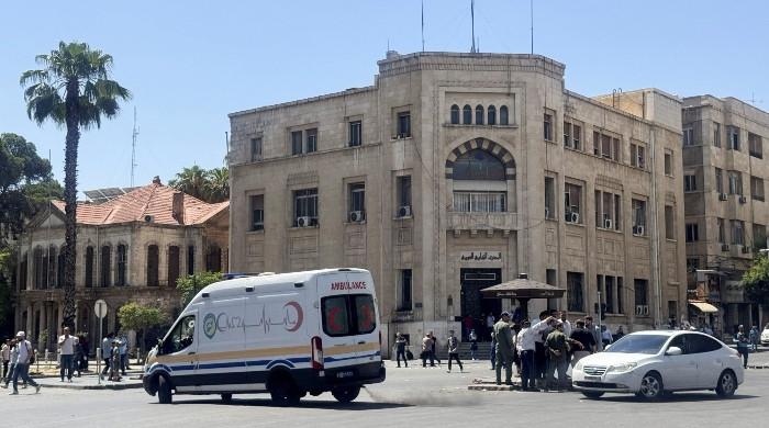 Blasts rock Damascus during French president visit