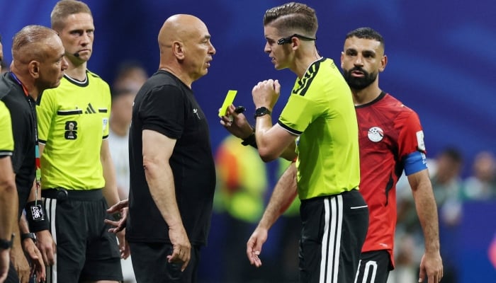 Egypt coach Hossam Hassan is shown a yellow card by referee Francois Letexier during their Round of 16 match against Argentina at the Atlanta Stadium in Georgia, US, July 7, 2026. — Reuters