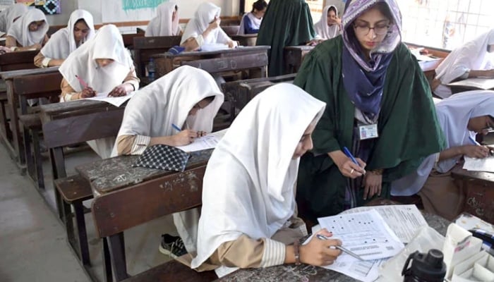 Students busy in solving their questioner during annual matriculation (9th and 10th grade) examinations under the Board of Secondary Education Karachi, in Karachi, April 11, 2026. — Online