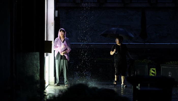 People use rain gear as rain intensifies ahead of the arrival of Typhoon Bavi in Wenzhou, Zhejiang province, China July 11, 2026. — Reuters