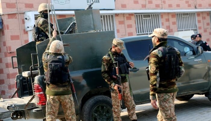 Security personnel stand guard outside a hospital in Dera Ismail Khan. — Reuters/File