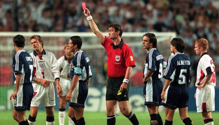 Englands David Beckham is shown the red card during their Second Round match of 1998 Fifa World Cup against Argentina at Stade Geoffroy Guichard, Saint Etienne, France. — Reuters/File