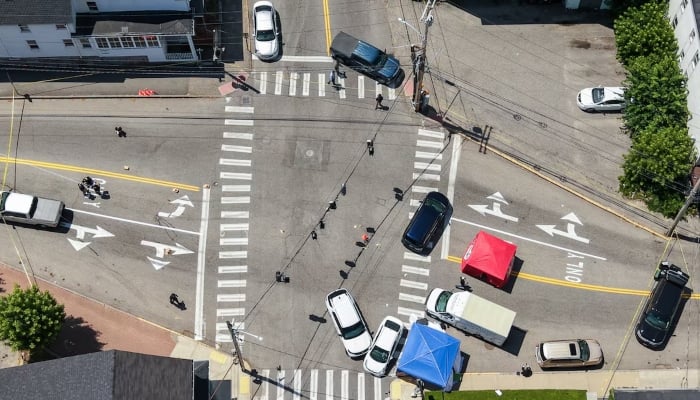 A drone view shows the cordoned-off area at the scene of a shooting involving US Immigration and Customs Enforcement (ICE) in Biddeford, Maine, US, July 13, 2026. — Reuters