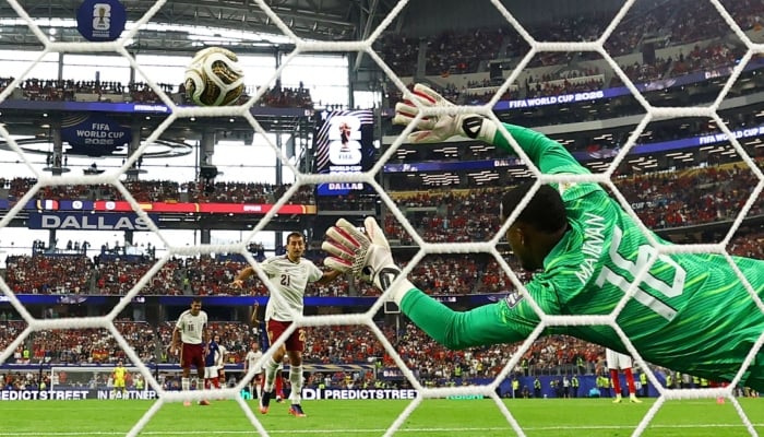 Spains Mikel Oyarzabal scores their first goal from the penalty spot on July 14, 2026. — Reuters