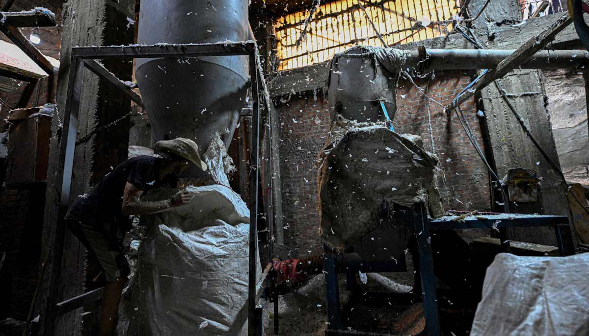 An Egyptian worker pepares plastic for processing at a recycling plant at the garbage city in the Manshiyet Nasser neighbourhood in Cairo on July 6, 2026.— AFP