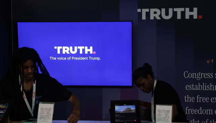 Workers straighten the Truth Social booth at the Great American State Fair celebrating the 250th anniversary of US independence in Washington, DC, US, July 2, 2026. — Reuters