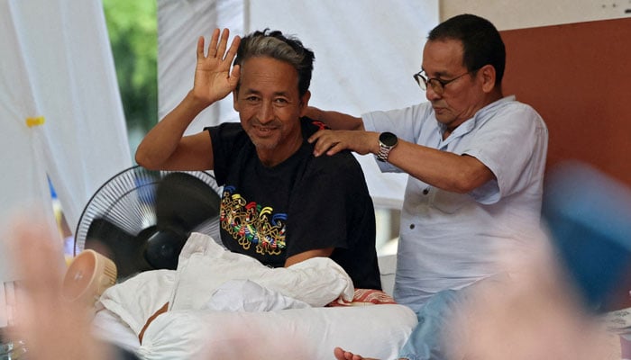 Sonam Wangchuk, an Indian education reformer, who has been on hunger strike, gestures as he recieves a back massage during a sit-in protest called by Cockroach Janta Party (CJP) demanding the resignation of Indian Education Minister Dharmendra Pradhan, at Jantar Mantar in New Delhi, India, July 17, 2026. — Reuters