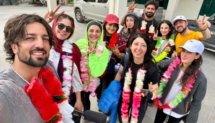From left: Noman Khan, Amina Shabbir, Sohniya Babar, Madeeha Syed, Smell Rose, Noormal Ahmed, Madhu Shala Akhtar, Kamran Khan, Mehrosh Akhtar and Samar Khan after returning to Chitral. — Reporter