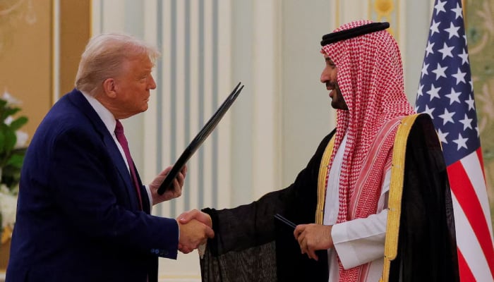 President Donald Trump and Saudi Crown Prince and Prime Minister Mohammed Bin Salman shake hands during a Memorandum of Understanding (MOU) signing ceremony at the Royal Court in Riyadh, Saudi Arabia, May 13, 2025. — Reuters