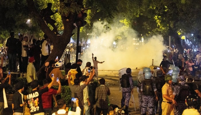 Police use teargas to control the crowd during the ongoing protest of Cockroach Janata Party (CJP), two days after thousands of protesters marched towards parliament demanding the resignation of Education Minister Dharmendra Pradhan over examination paper leaks, at Jantar Mantar in New Delhi, India, July 22, 2026. — Reuters