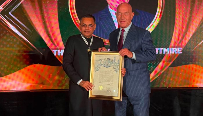 Pakistani-American community leader receives award from Houston Mayor John Whitmire. — Reporter
