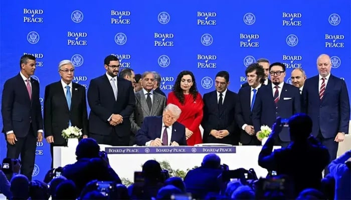 Prime Minister Shehbaz Sharif and others pose with US President Donald Trump signing the founding charter at the “Board of Peace” meeting during the World Economic Forum annual meeting in Davos, Switzerland on January 22, 2026. — AFP