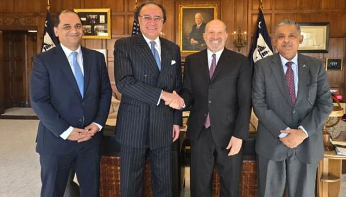 Finance Minister Muhammad Aurangzeb (second from left) shakes hand with US Commerce Secretary Howard A Lutnick as the two meet at the Department of Commerce in Washington. — X@Financegovpk/File