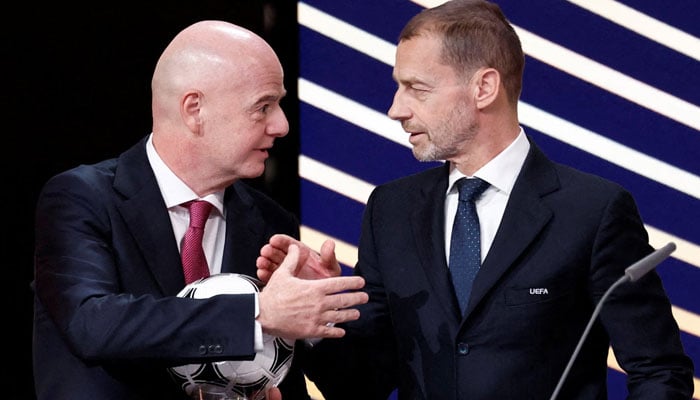 Uefa president Aleksander Ceferin (right) and Fifa president Gianni Infantino shake hands during an event.  — Reuters/File