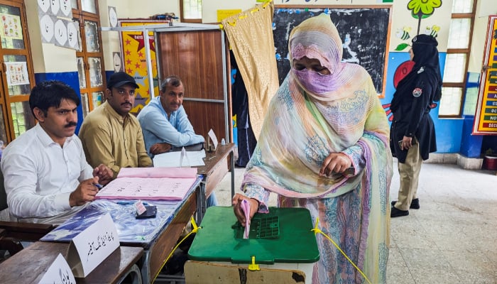 A woman votes during the second phase of the Azad Jammu and Kashmir (AJK) Legislative Assembly elections at a polling station in Muzaffarabad, August 2, 2026. — Reuters