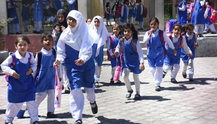 Students on their way home after school in Islamabad on May 10, 2023. — Online