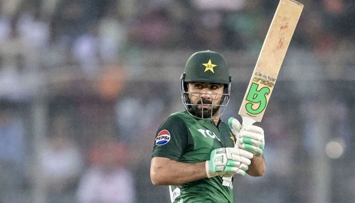 Pakistans Khushdil Shah watches the ball after playing a shot during their ICC Mens Champions Trophy match against India at the Dubai International Cricket Stadium in Dubai on February 23, 2025. — AFP