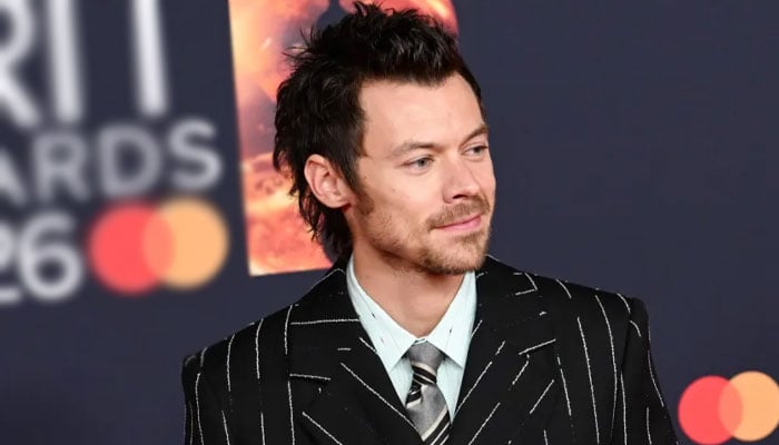 Harry Styles sings ‘Happy Birthday’ for Zane Lowe during rainy concert