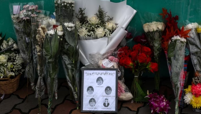 Flowers and pictures of teachers killed are left outside Debsirin Nonthaburi School following a deadly shooting at the school, in Bang Kruai district in Nonthaburi province, on the outskirts of Bangkok, Thailand, August 9, 2026. — Reuters