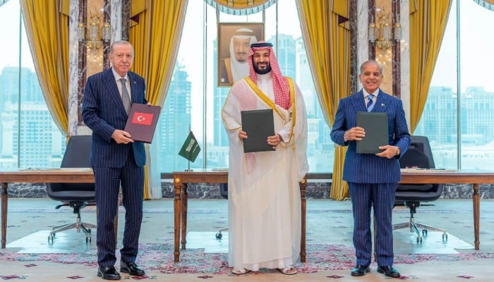 Turkish President Tayyip Erdogan, Saudi Crown Prince Mohammed bin Salman and Prime Minister Shehbaz Sharif pose after signing a joint defence agreement in Makkah, Saudi Arabia, August 7, 2026. — Reuters