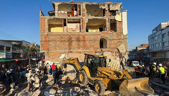 Residents and emergency personnel dig through the debris of a collapsed building following an earthquake, in Cali, Colombia August 10, 2026. — Reuters