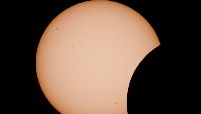 The moon partially covers the sun during a solar eclipse as seen from Arija, Spain, August 12, 2026. — Reuters