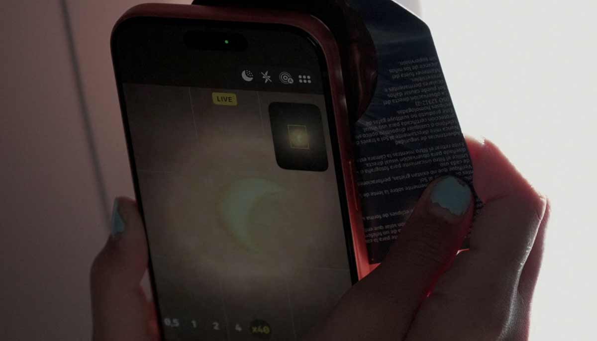 A passenger uses a mobile phone camera during a special Iberia flight on the day of a total solar eclipse over the skies of Spain, August 12, 2026.— Reuters